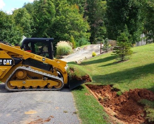 ditch-drainage-Cat- 299D-excavation-grading