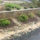 drainage-terraced landscaping-retaining walls-stone rock-gravel driveway